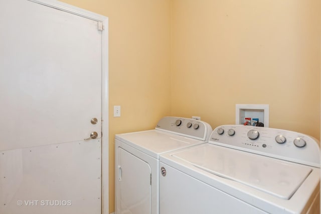 clothes washing area with laundry area and washing machine and clothes dryer