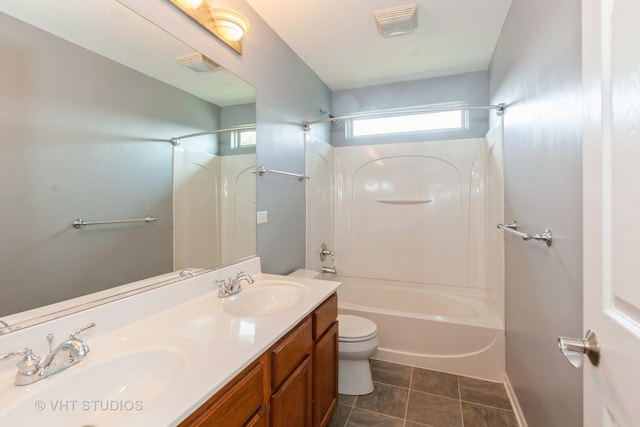 bathroom featuring  shower combination, visible vents, a sink, and toilet