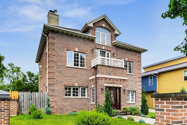 2609 Eisenhower Dr, Des Plaines, IL 60018 - back of property with brick siding, a balcony, and a chimney