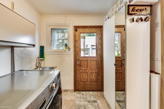 2609 Eisenhower Dr, Des Plaines, IL 60018 - laundry area with washer and clothes dryer and crown molding