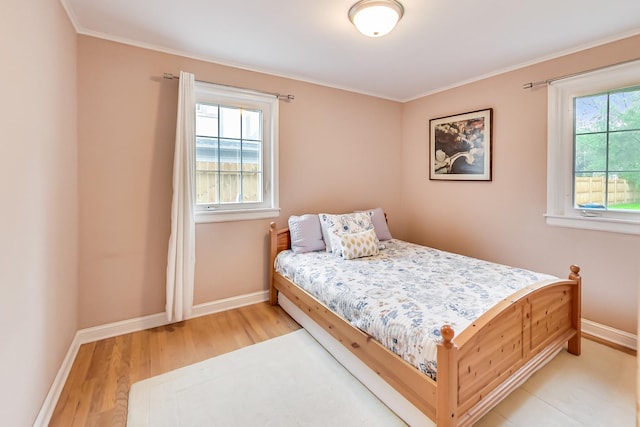 2609 Eisenhower Dr, Des Plaines, IL 60018 - bedroom with light wood-type flooring and crown molding