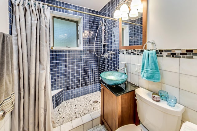 2609 Eisenhower Dr, Des Plaines, IL 60018 - bathroom with tile walls, tiled shower, vanity, and tile patterned floors