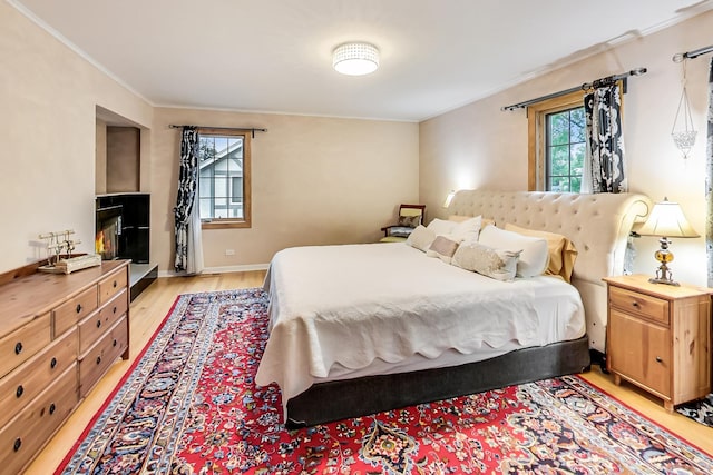 2609 Eisenhower Dr, Des Plaines, IL 60018 - bedroom featuring crown molding and light wood-style flooring