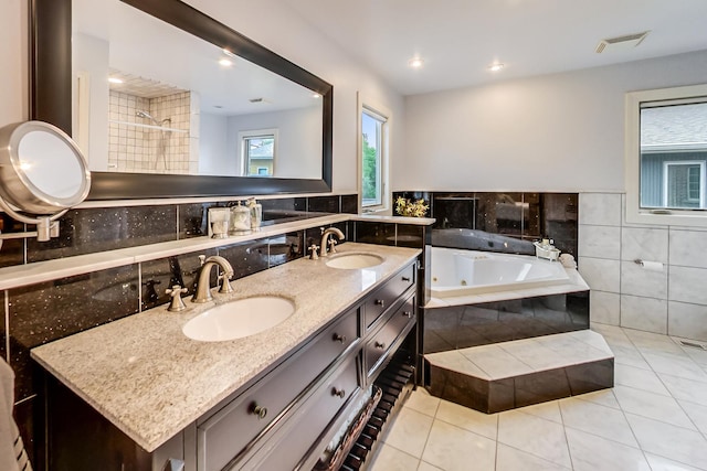 2609 Eisenhower Dr, Des Plaines, IL 60018 - bathroom with a tub with jets, tile patterned floors, double vanity, and recessed lighting
