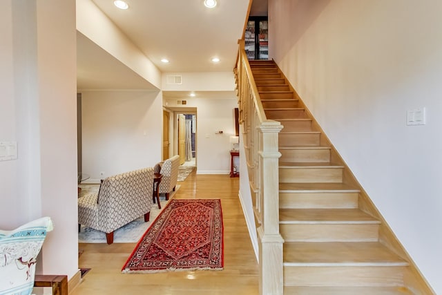 2609 Eisenhower Dr, Des Plaines, IL 60018 - staircase with wood finished floors and recessed lighting