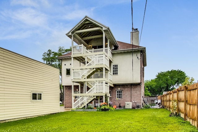 2609 Eisenhower Dr, Des Plaines, IL 60018 - back of property featuring stairs, a chimney, and brick siding