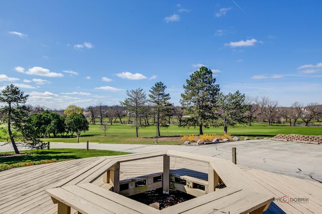 exterior space featuring a yard and view of golf course