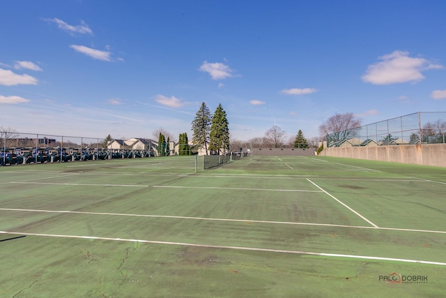 view of tennis court with fence