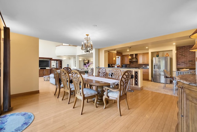 8209 N Oleander Ave, Niles, IL 60714 - dining area featuring a chandelier and light wood finished floors