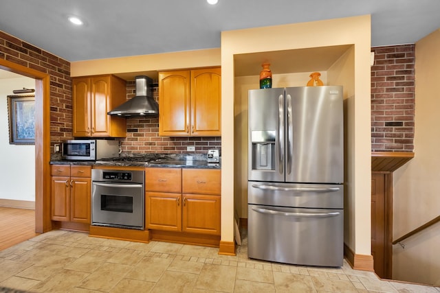 8209 N Oleander Ave, Niles, IL 60714 - kitchen featuring appliances with stainless steel finishes, wall chimney exhaust hood, tasteful backsplash, brown cabinets, and recessed lighting