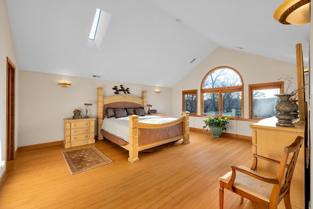 8209 N Oleander Ave, Niles, IL 60714 - bedroom featuring a skylight, lofted ceiling, and light wood-style floors