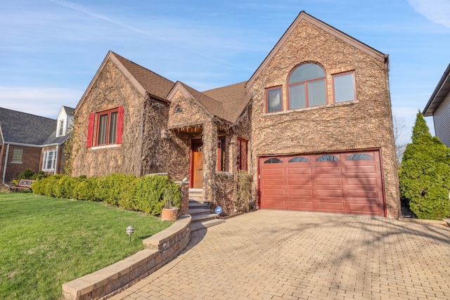 8209 N Oleander Ave, Niles, IL 60714 - view of front of home with a front yard, a garage, decorative driveway, brick siding, and stone siding