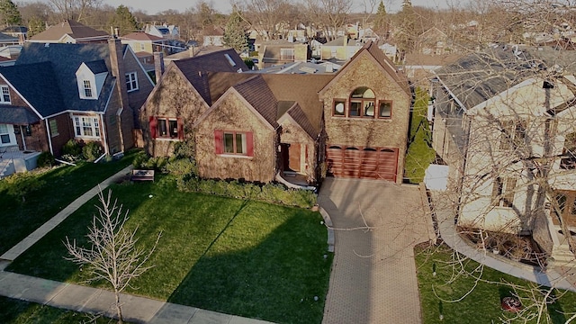 8209 N Oleander Ave, Niles, IL 60714 - view of front of property with stone siding, aphalt driveway, a residential view, and a garage