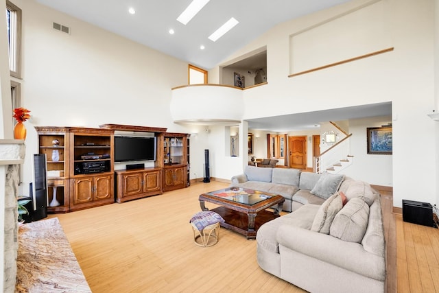 8209 N Oleander Ave, Niles, IL 60714 - living room with high vaulted ceiling, light wood-style floors, stairway, and recessed lighting