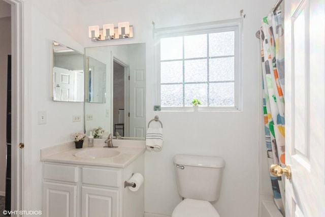 full bathroom featuring toilet, shower / bathtub combination with curtain, and vanity