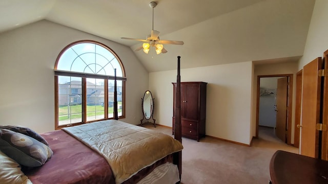 bedroom featuring baseboards, a ceiling fan, light carpet, and vaulted ceiling