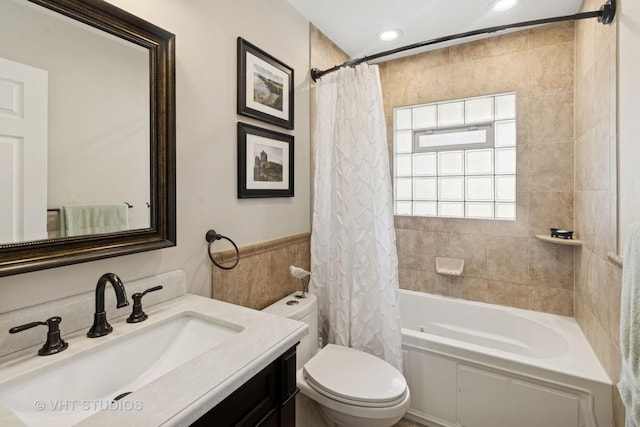 137 S Hickory St, Palatine, IL 60067 - full bath with a wainscoted wall, shower / bathtub combination with curtain, toilet, vanity, and tile walls