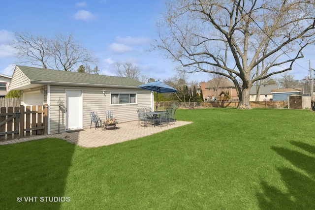 137 S Hickory St, Palatine, IL 60067 - view of yard featuring a fenced backyard, an outbuilding, a storage unit, and a patio