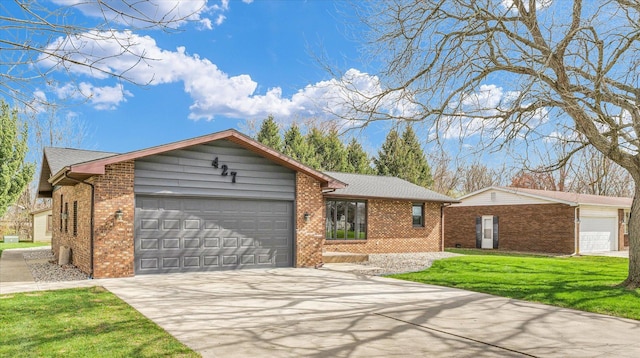ranch-style house with an attached garage, concrete driveway, a front yard, and brick siding