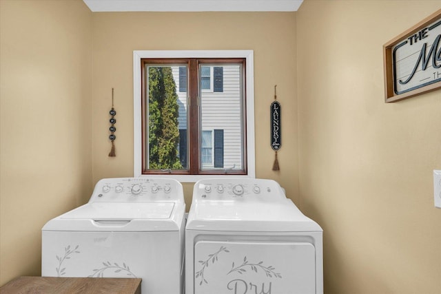 washroom with separate washer and dryer and laundry area