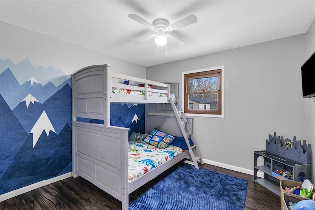bedroom featuring dark wood-type flooring, baseboards, and a ceiling fan