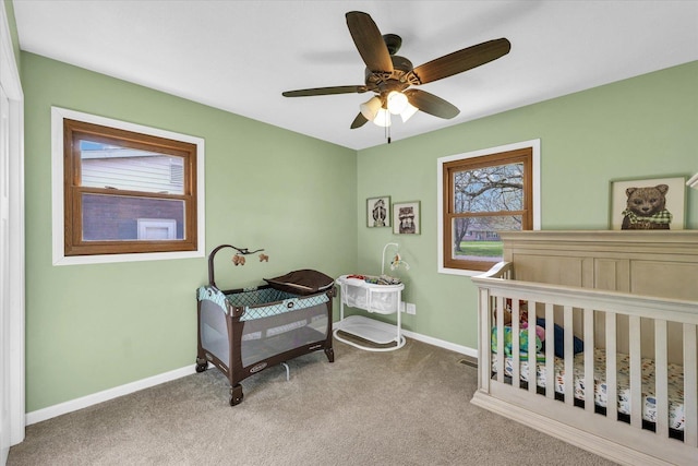 bedroom with carpet floors, baseboards, and a ceiling fan