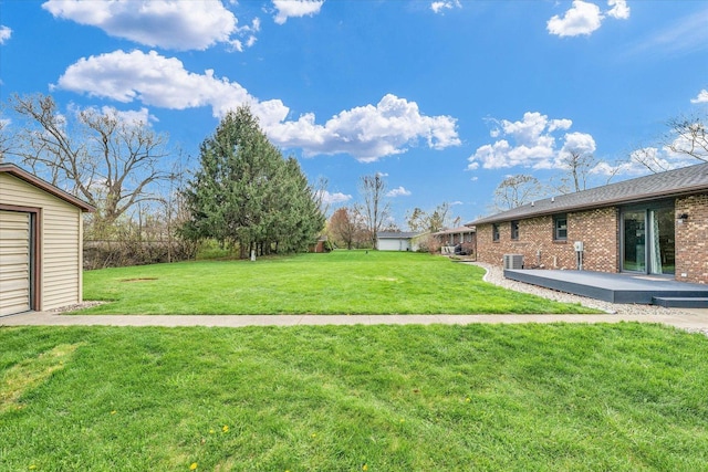 view of yard with a patio and central AC