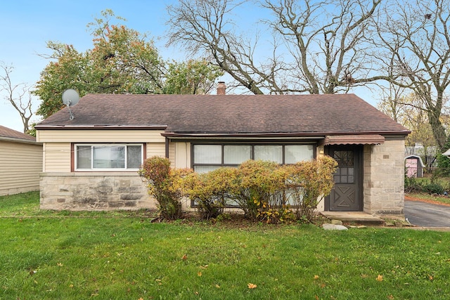 303 Sauk Trl, Park Forest, IL 60466 - view of front of home with a front yard, roof with shingles, and a chimney