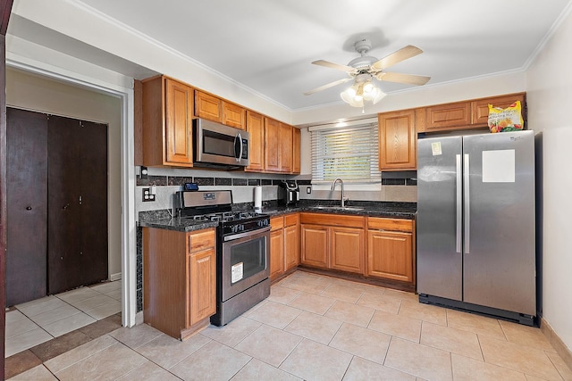 303 Sauk Trl, Park Forest, IL 60466 - kitchen with stainless steel appliances, a sink, brown cabinetry, decorative backsplash, and crown molding