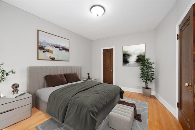837 Erie St Unit 1, Oak Park, IL 60302 - bedroom with baseboards and light wood finished floors