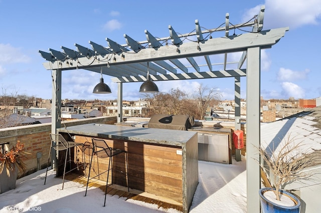 view of patio / terrace with a pergola, a grill, and outdoor wet bar