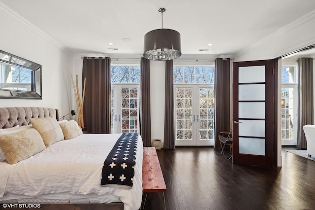 bedroom with ornamental molding, french doors, an inviting chandelier, and dark wood-type flooring