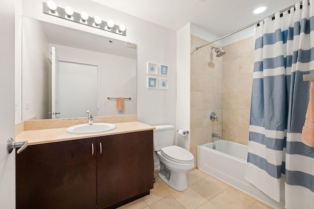 bathroom with toilet, tile patterned floors, vanity, and shower / tub combo