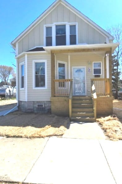 7825 S Saint Lawrence Ave, Chicago, IL 60619 - bungalow with board and batten siding and covered porch
