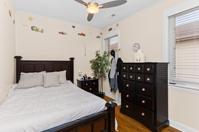 5305 Farwell Ave, Skokie, IL 60077 - bedroom with wood finished floors, ceiling fan, baseboards, and visible vents