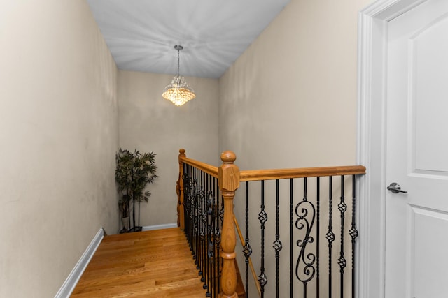 5305 Farwell Ave, Skokie, IL 60077 - stairway with a chandelier, baseboards, and wood finished floors