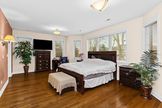5305 Farwell Ave, Skokie, IL 60077 - bedroom with multiple windows, baseboards, and wood finished floors