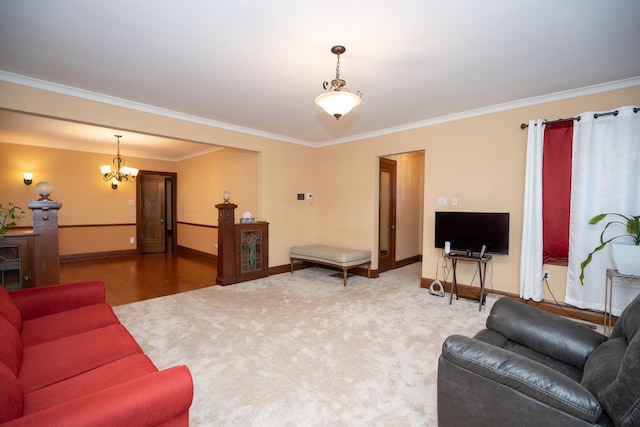 living area featuring ornamental molding, baseboards, an inviting chandelier, and wood finished floors
