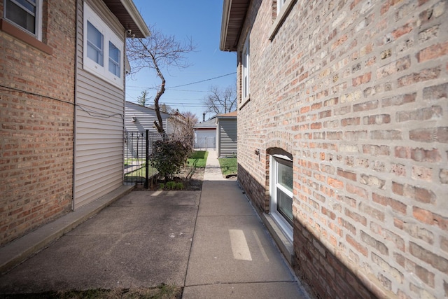 view of property exterior with brick siding