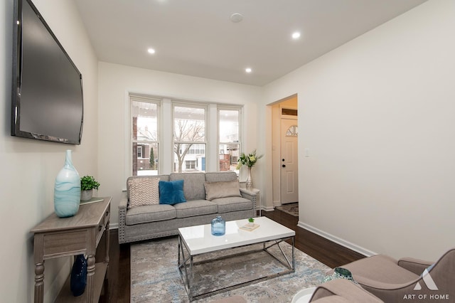 living room featuring recessed lighting, baseboards, and dark wood finished floors