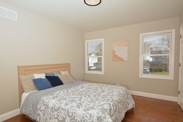 241 Butte View Dr N, Bolingbrook, IL 60490 - bedroom featuring visible vents, baseboards, and wood finished floors