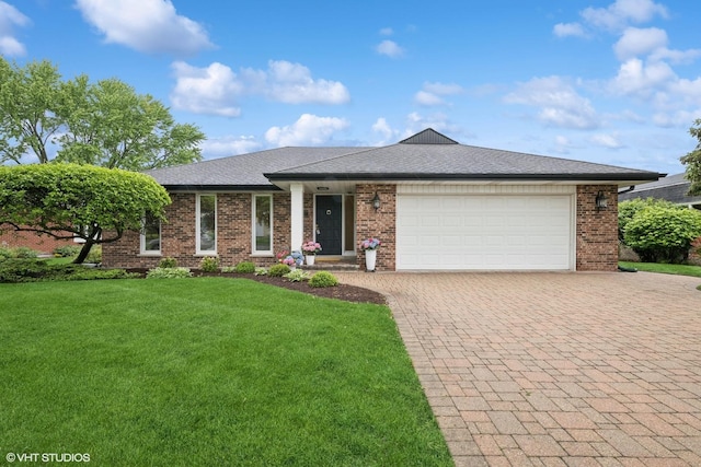 1115 S Vail Ave, Arlington Heights, IL 60005 - view of front facade featuring decorative driveway, a front lawn, an attached garage, and brick siding