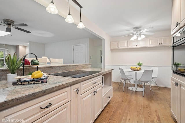 1115 S Vail Ave, Arlington Heights, IL 60005 - kitchen featuring a ceiling fan, black electric cooktop, light wood-type flooring, light stone counters, and decorative light fixtures