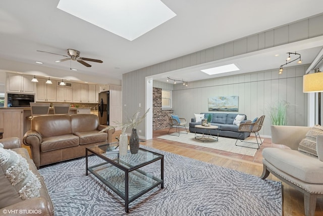 1115 S Vail Ave, Arlington Heights, IL 60005 - living room with a skylight, light wood-style floors, baseboards, and a ceiling fan