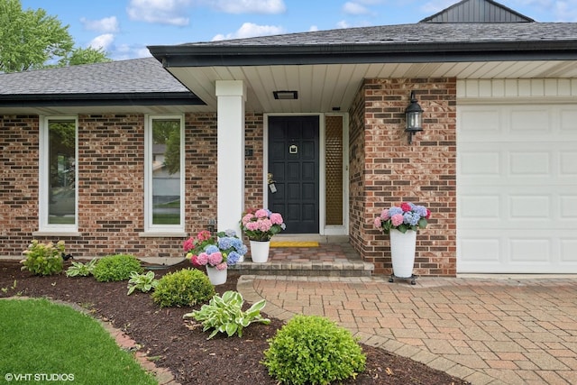 1115 S Vail Ave, Arlington Heights, IL 60005 - property entrance with brick siding, a garage, and roof with shingles