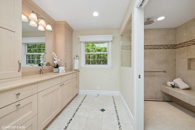 1115 S Vail Ave, Arlington Heights, IL 60005 - bathroom featuring vanity, baseboards, tile patterned flooring, plenty of natural light, and recessed lighting