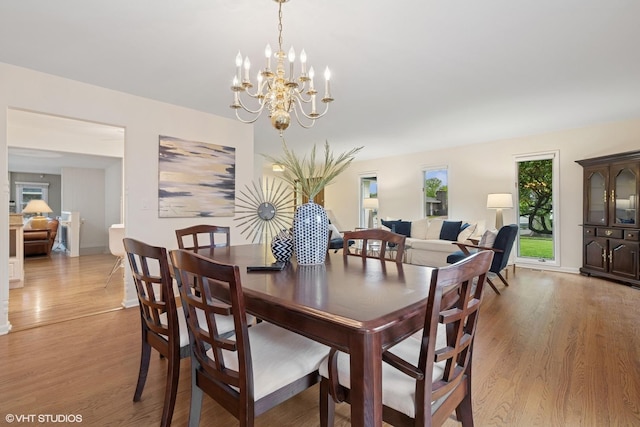 1115 S Vail Ave, Arlington Heights, IL 60005 - dining space featuring light wood-style floors, a chandelier, and baseboards