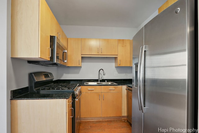 21 W Chestnut St Unit 1509, Chicago, IL 60610 - kitchen featuring stainless steel appliances, wood finished floors, dark stone counters, and light brown cabinets