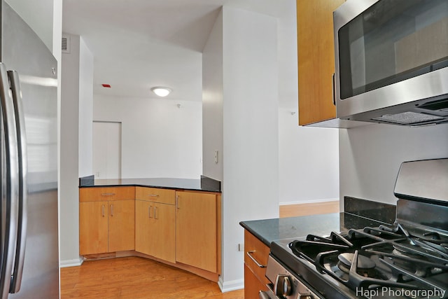 21 W Chestnut St Unit 1509, Chicago, IL 60610 - kitchen featuring appliances with stainless steel finishes and light wood-type flooring