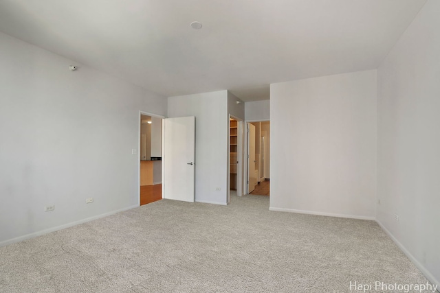 21 W Chestnut St Unit 1509, Chicago, IL 60610 - unfurnished bedroom featuring carpet, a spacious closet, and a closet